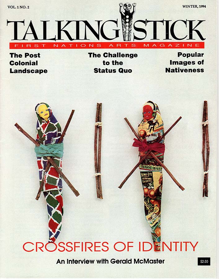 Couverture du magazine Talking Stick, montrant deux Barbies enveloppées dans du tissu coloré attaché avec des rubans et des bouts de bois.  